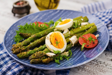 Warm salad of roasted asparagus, feta cheese, tomatoes and eggs.