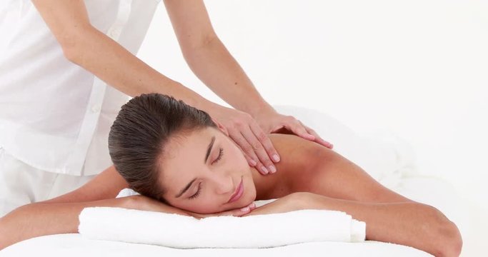 Woman enjoying a shoulder massage in high quality 4k format