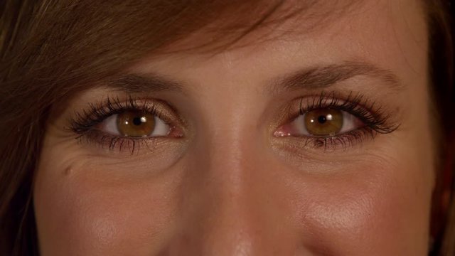 CLOSE UP: Woman squinting eyes