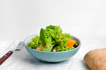 Healthy vegetarian salad with tomatoes in a bowl