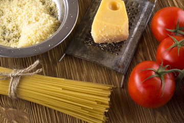 Pasta, tomatoes and grated cheese.