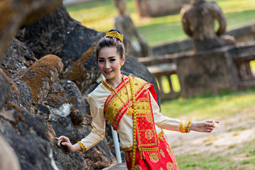 Fototapeta premium Beautiful woman at Thailand traditional dress in temple.