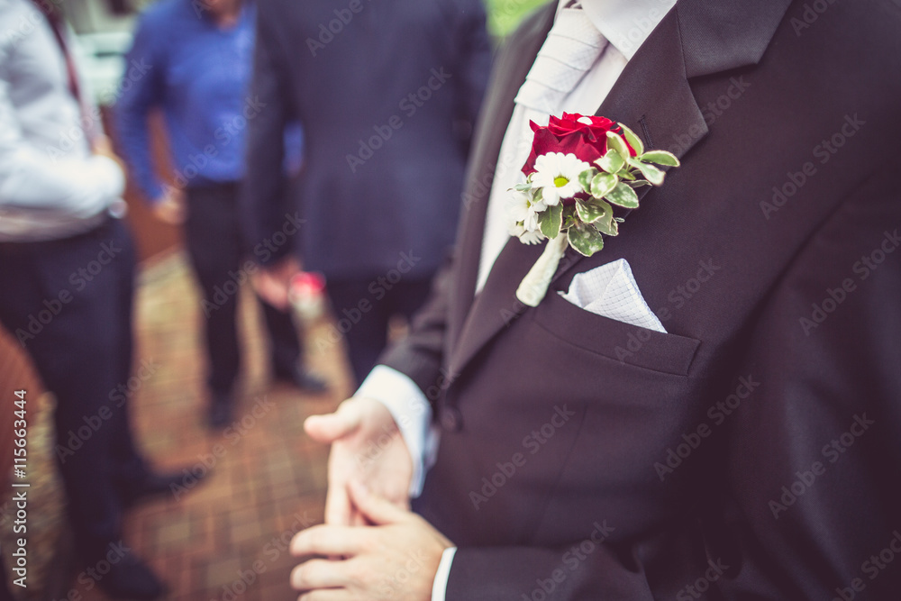 Wall mural Flower on husband suit on wedding