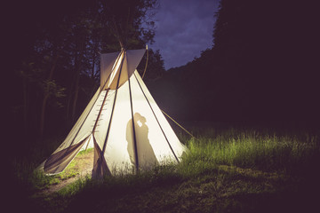Wedding couple at night in big teepee © JanBerounsky