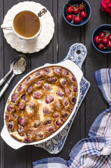 Clafoutis with cherries and powdered sugar for breakfast  