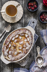 Clafoutis with cherries and powdered sugar for breakfast  