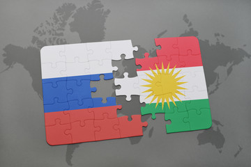 puzzle with the national flag of russia and kurdistan on a world map background.