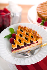 Modern new recipe raspberry berry tart pie holiday snack treat served on a plate