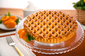Whole homemade fresh apricot peach pie tart golden crust fruit filled delicious dessert