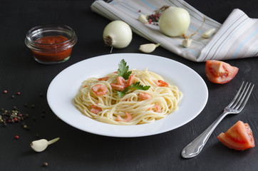 Pasta with shrimps and tomato sauce