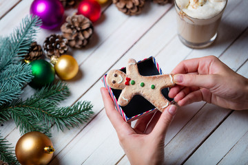 female hands wrapping a cookie