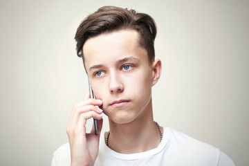 Young handsome man calls by mobile telephone