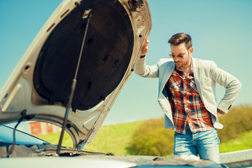 Men having problem with car.