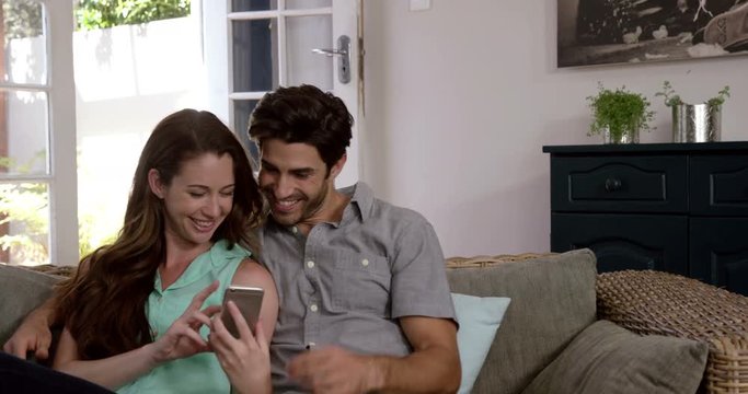 Cute couple taking a selfie with a smartphone