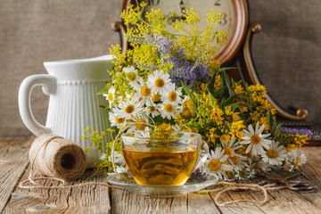 Chamomile tea on wooden kitchen table