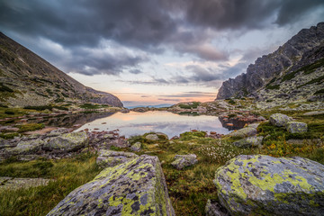 Mountain Lake Above Skok Waterfall with Rocks in Foreground at Sunset. Mlynicka Valley, High Tatra, Slovakia. © kaycco