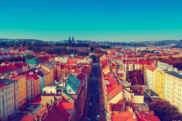 Fototapeta premium View to the Vysegrad in Prague, Czech Republic at autumn with cathedral and red roofs, travel seasonal vintage hipster background