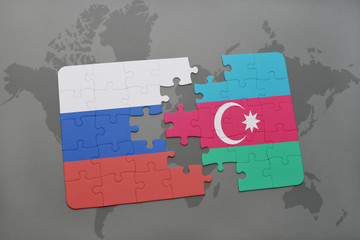 puzzle with the national flag of russia and azerbaijan on a world map background.