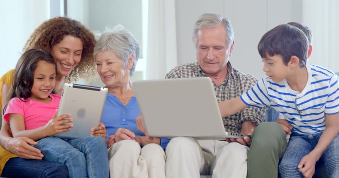 Family using laptop and tablet
