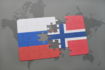 puzzle with the national flag of russia and norway on a world map background.