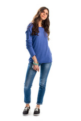 Obraz premium Woman in blue sweater. Young lady holding cell phone. Casual apparel of light colors. How to dress simple.
