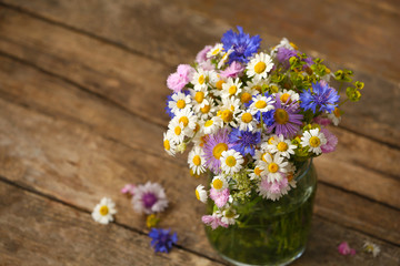 Wildflower bouquet on wooden table