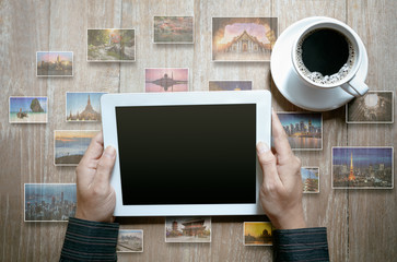 Fototapeta na wymiar Top view of tablet on wooden background, Travel concept