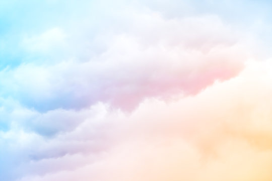 Rainbow Clouds.  A soft cloud background with a pastel colored orange to blue gradient.