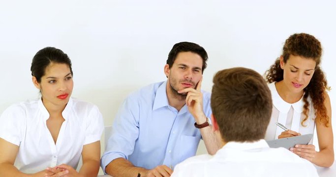 Interview panel listening to job applicant