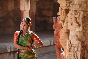 kuchipudi is one of the classical dance forms of india,belongs to state andhra pradesh.here the dancer poses at bhoga nadeeshwara temple near bangalore © fotomagic
