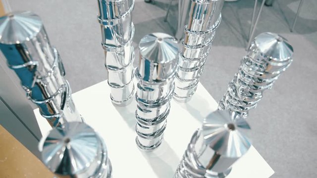 Shiny chrome Archimedean screws for different types of work