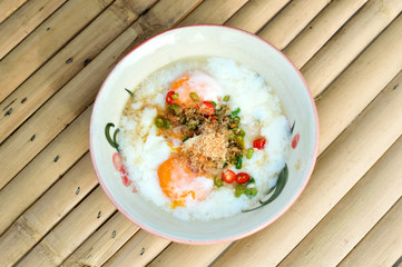 Soft boiled egg for breakfast on wooden table