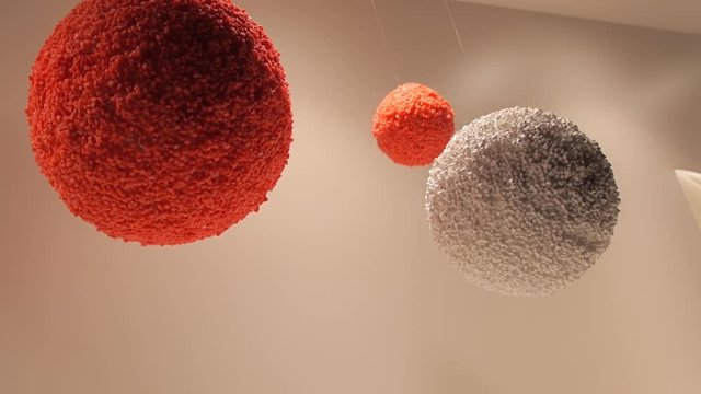 Samples of multi-colored plastic pellets in the creative form of sphere