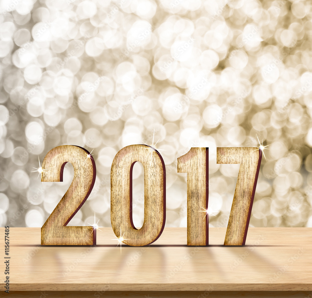 Aufkleber 2017 year wood texture on plain wood table top with gold sparkli