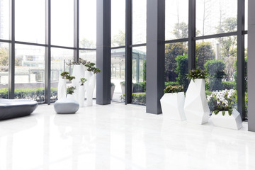 elegant stools and talbe in huge and bright hall