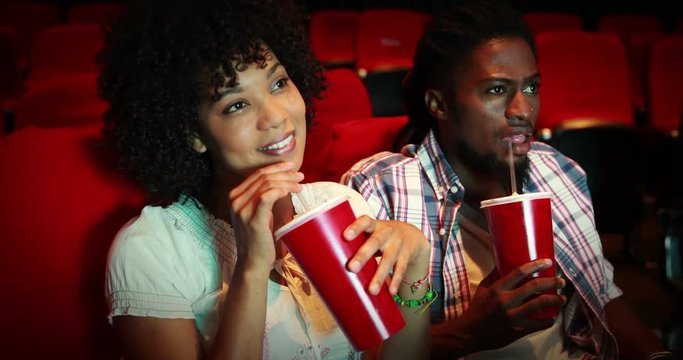 Friends watching movie at the cinema 