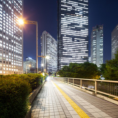 modern office buildings in downtown of tokyo at night
