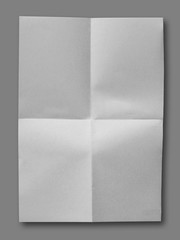 White crumpled paper on gray background isolated with clipping path.