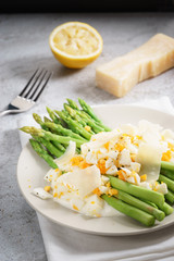 Asparagus salad with crumble boiled egg and parmesan cheese
