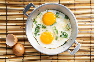 fried egg with green spinach