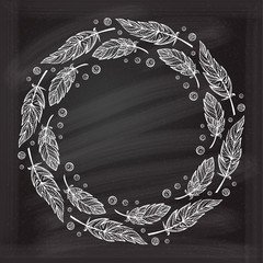 Vector round zendoodle feathers frame on a chalkboard