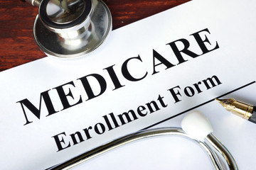 Medicare enrollment form written on a paper.  Medical concept.