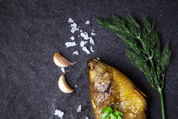 Delicious grilled fresh fish on dark stone background , healthy