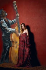 fashion model in long designers dress in night show