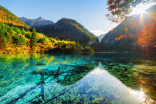 Scenic view of the Five Flower Lake among woods and mountains