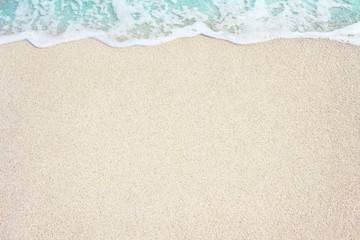 Soft ocean wave on the sandy beach, background. - obrazy, fototapety, plakaty