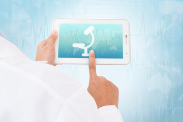 Doctor hand touch screen Microscope symbol on a tablet. medical icon