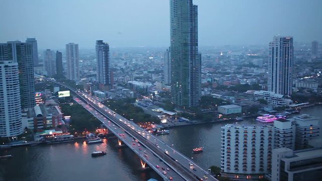 BANGKOK THAILAND - APRIL 11: Business Transportation Road in Building Bangkok city area with light flare, high angle shot in HD, Sathorn District BANGKOK, Thailand on April 11, 2015