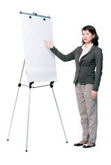 Half-turned woman presenting something on white board. Full length portrait isolated on white background.