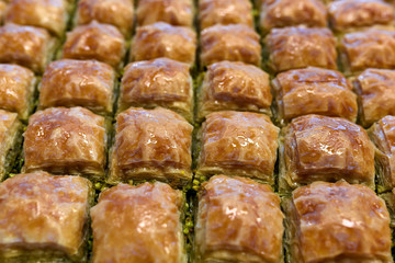 Baklava is a rich, sweet pastry made of layers of filo filled with chopped nuts and sweetened and held together with syrup or honey